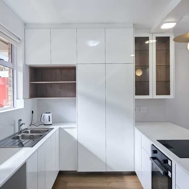 White kitchen with built-in cupboards